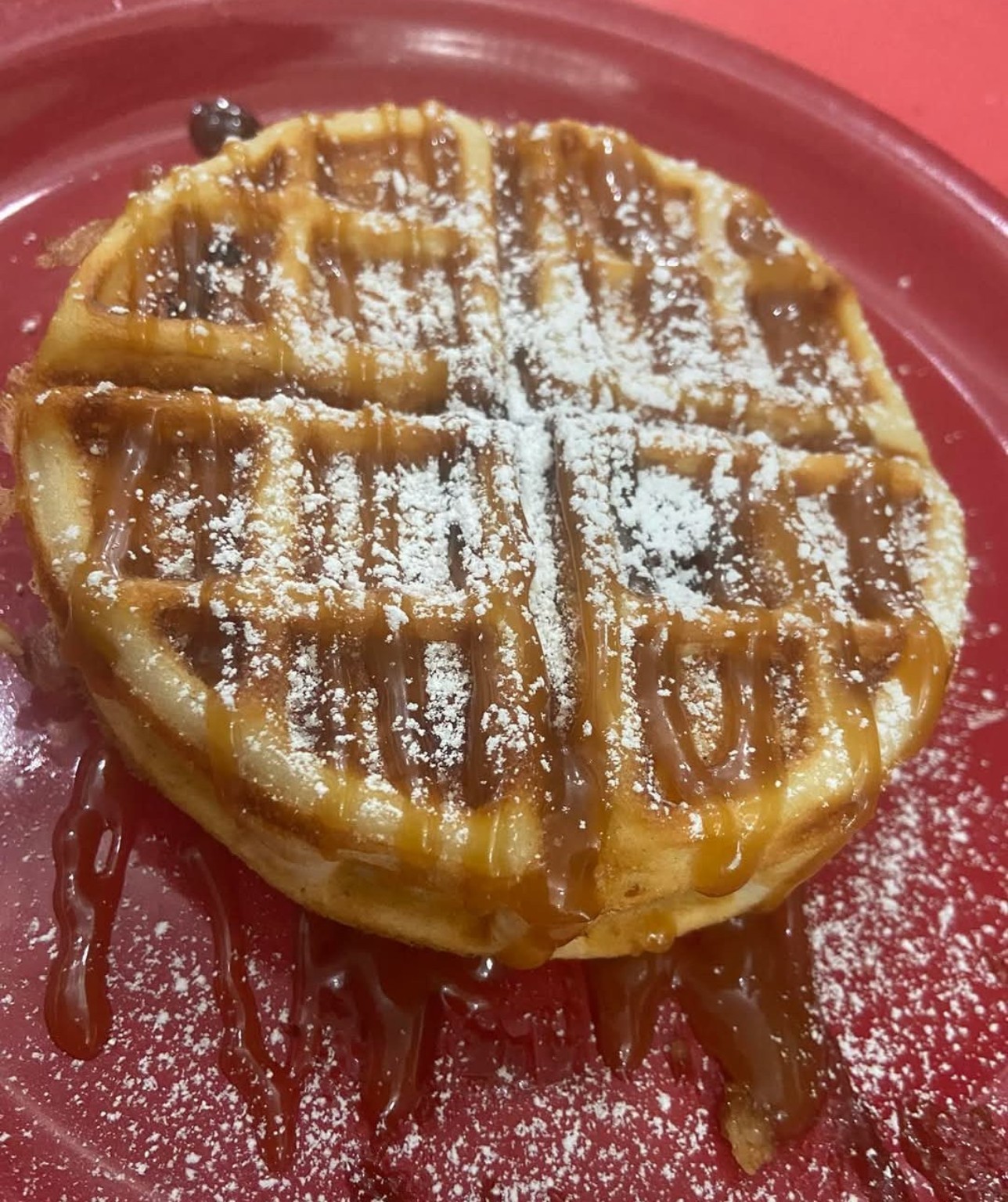 A waffle dusted with powdered sugar